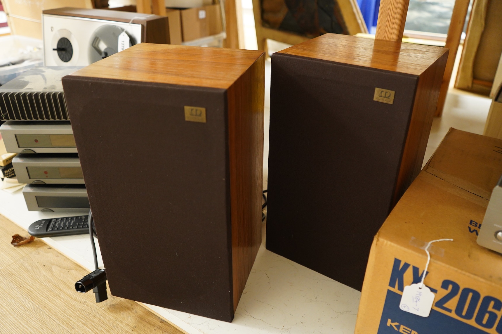 Four Quad Electroacoustics Ltd. stereo separates; a Quad 306 Power Amplifier, serial no. Q024306, a Quad 66 Preamplifier, a Quad 67 CD Player with remote control and a Quad 66 FM Tuner
